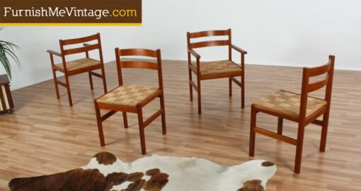 Set of four Danish teak mid century modern dining chairs with rush seats