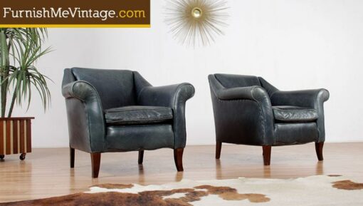Pair of gently worn teal leather arm chairs