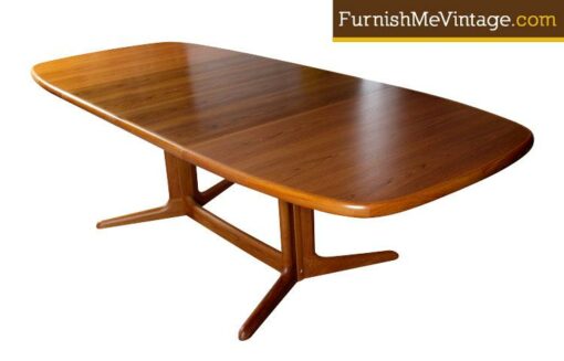 Mid century modern Danish teak dining table by Skovby