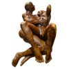 Sensual lovers monkeypod wood carved coffee table with glass top