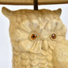 Jewel-like orange plastic eyes on owl lamp