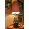 Mid-Century Modern green and gold Plasto table lamp lit up