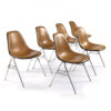 Set of 6 stackable Eames fiberglass shell pads with brown naugahyde seat pads