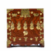 Ornately embellished brass hardware on Asian rosewood nightstand