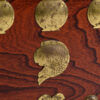 Brass fish emblem on Asian rosewood chest