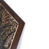 dark brown wood frame with gold metallic inset on painting