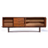 Drawers and doors open on long teak credenza
