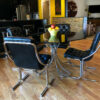Vintage 1970s black and chrome dining set with Daystrom scoop chairs and pedestal dining table