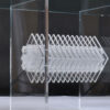 Prism at center of Lucite table base with frosted and clear acrylic
