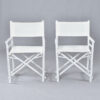 Pair of vintage white rattan directors chairs with white canvas slings
