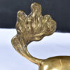 Tail of large brass unicorn sculpture