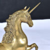 Detail on face and horn of large brass unicorn sculpture