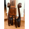 Side view of Witco carved cats splits in wood visible
