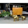 Large scale brass elephants next to a burl Thayer Coggin bar