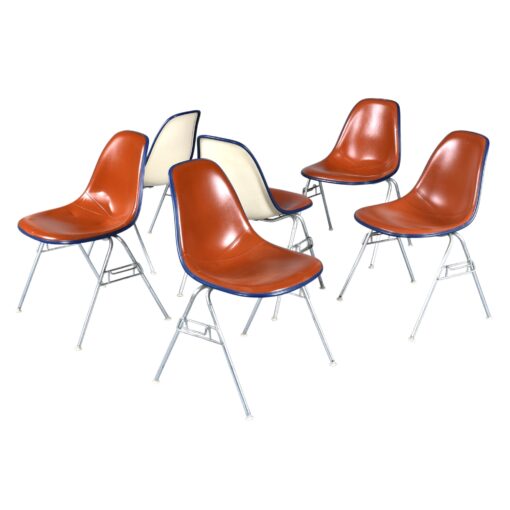 Eames red orange naugahyde pad DSS stacking chairs from Eastern Airlines