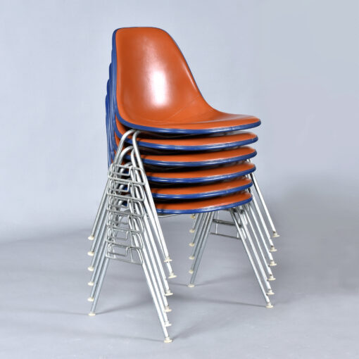 Eames red orange naugahyde pad DSS stacking chairs from Eastern Airlines