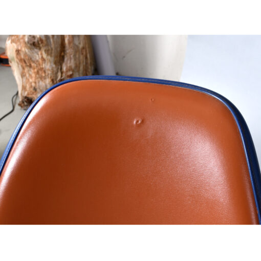 Eames red orange naugahyde pad DSS stacking chairs from Eastern Airlines