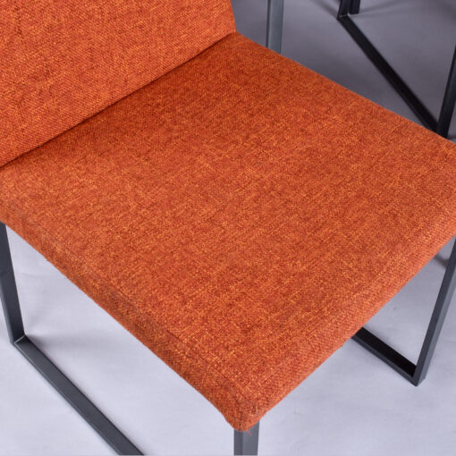 Trica Curvo orange upholstered modern dining chairs from Quebec