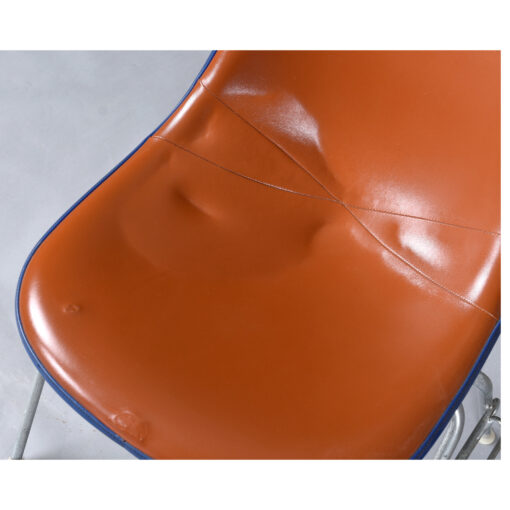 Eames red orange naugahyde pad DSS stacking chairs from Eastern Airlines
