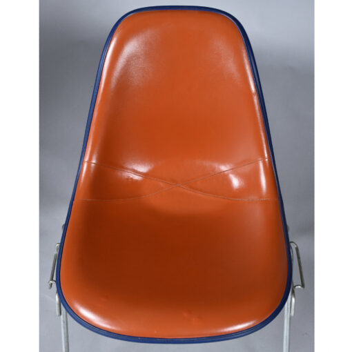 Eames red orange naugahyde pad DSS stacking chairs from Eastern Airlines