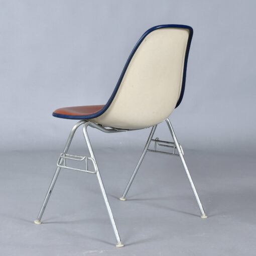 Eames red orange naugahyde pad DSS stacking chairs from Eastern Airlines
