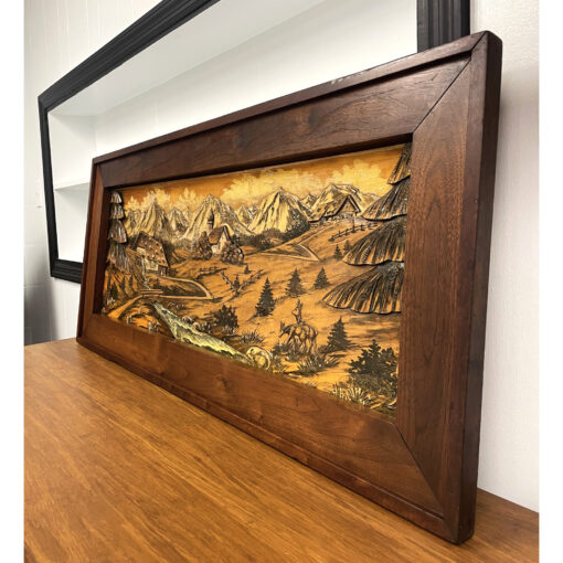 Carved wood painting of Bavarian or Alpine village