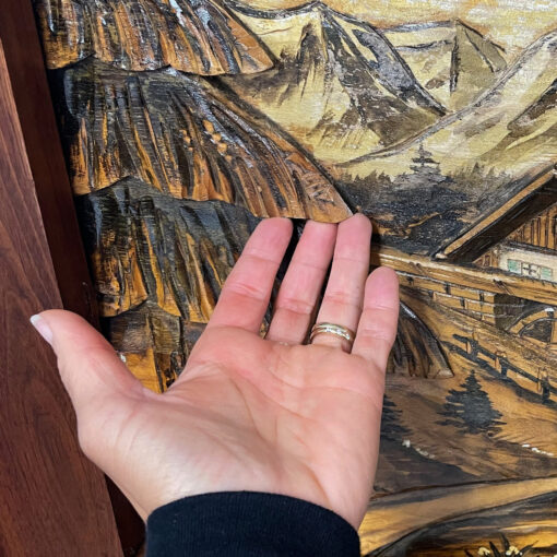 Carved wood painting of Bavarian or Alpine village