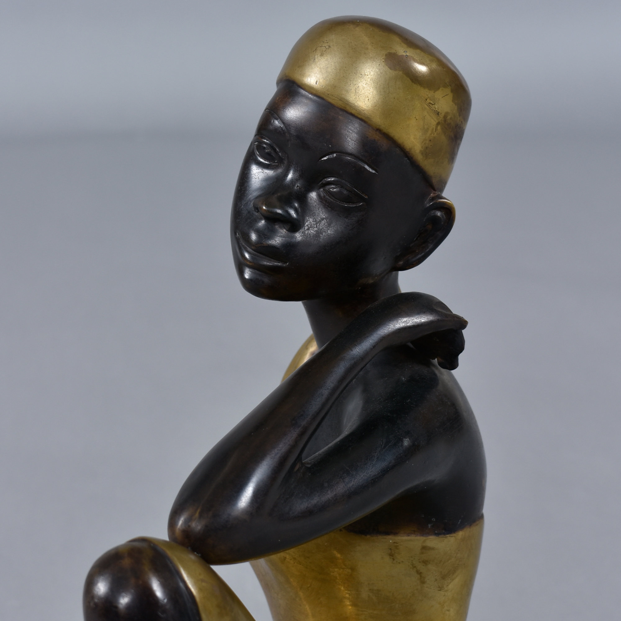 Karl Hagenauer style seated African woman bronze table top sculpture
