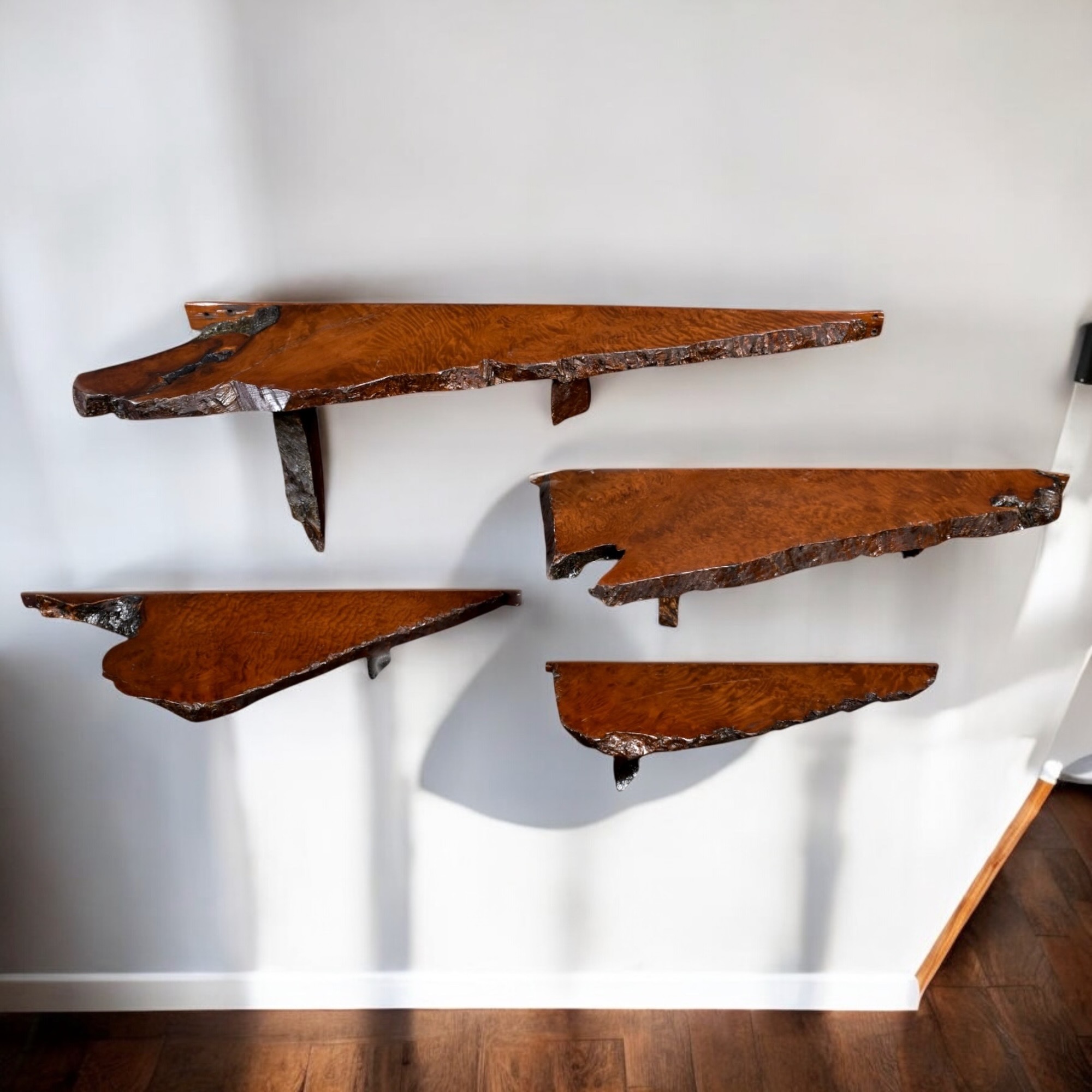 Group of live edge redwood wall mounted shelves