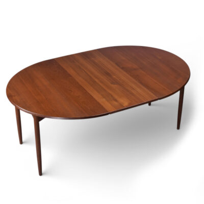 Circle to oval Mid-Century Modern expanding Danish teak dining table with 2 leaves
