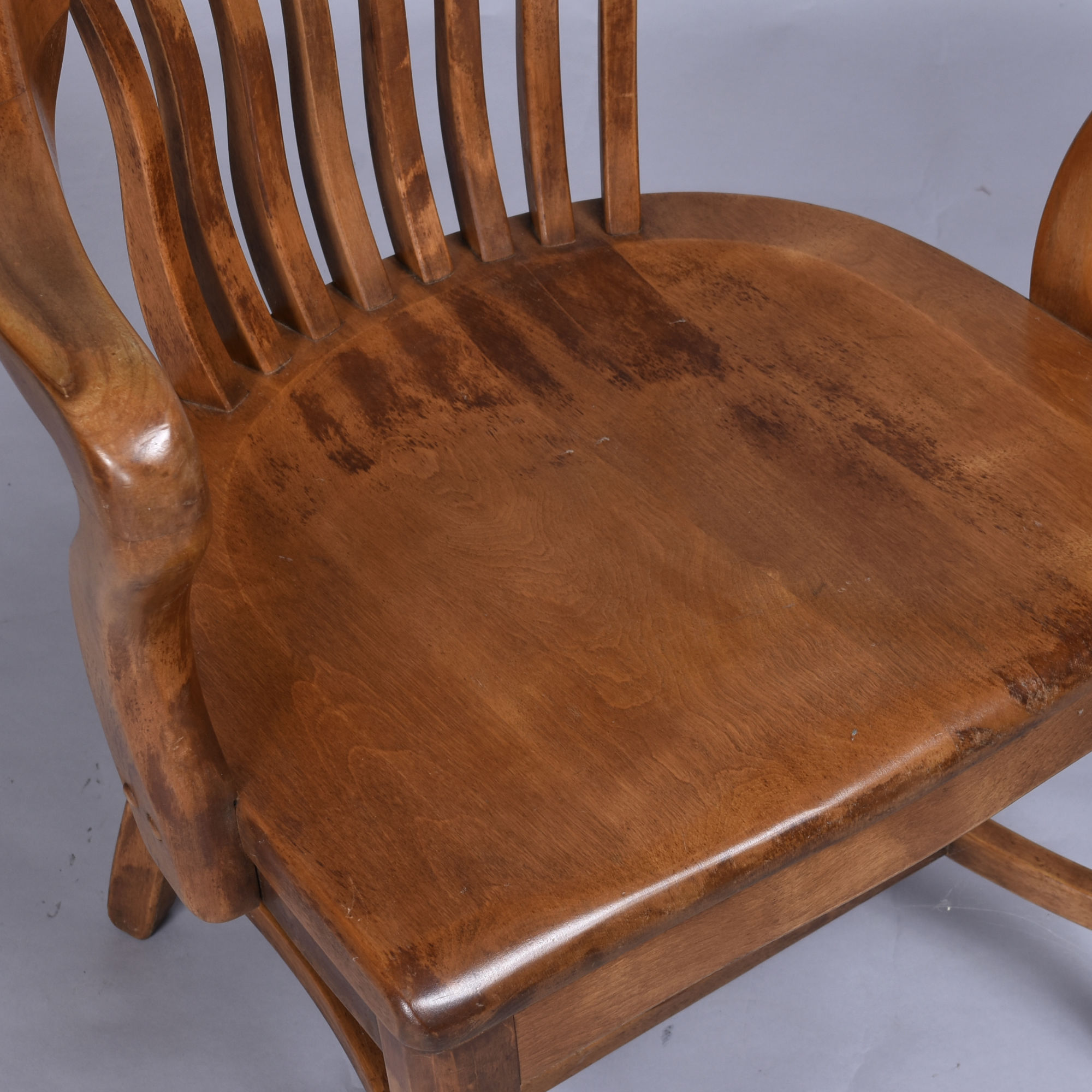 Wear on solid wood vintage bankers or library chairs